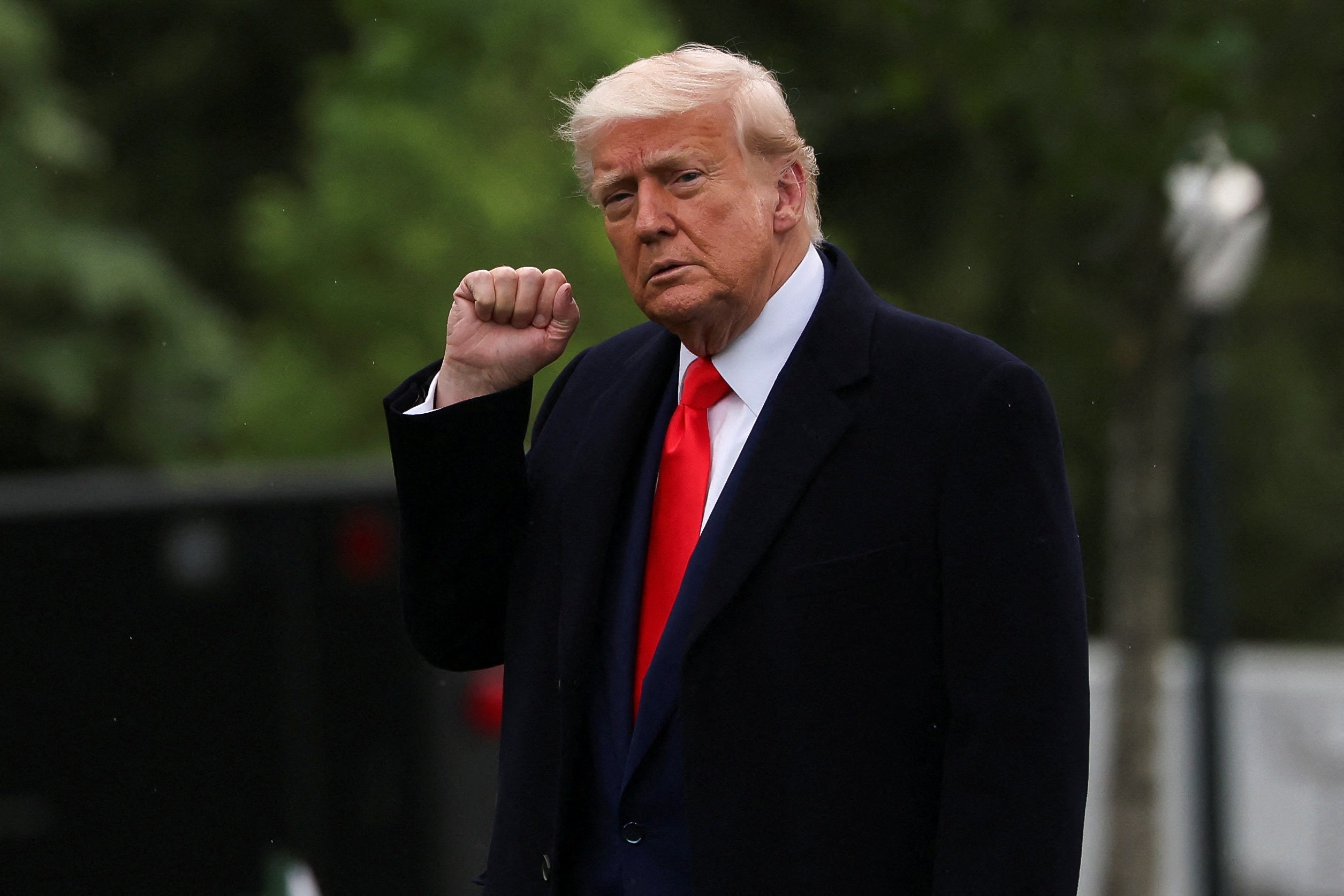 Donald Trump attends a dinner for the top 220 buyers of his meme coin, which featured subpar food and him speaking from a lectern emblazoned with the presidential seal.