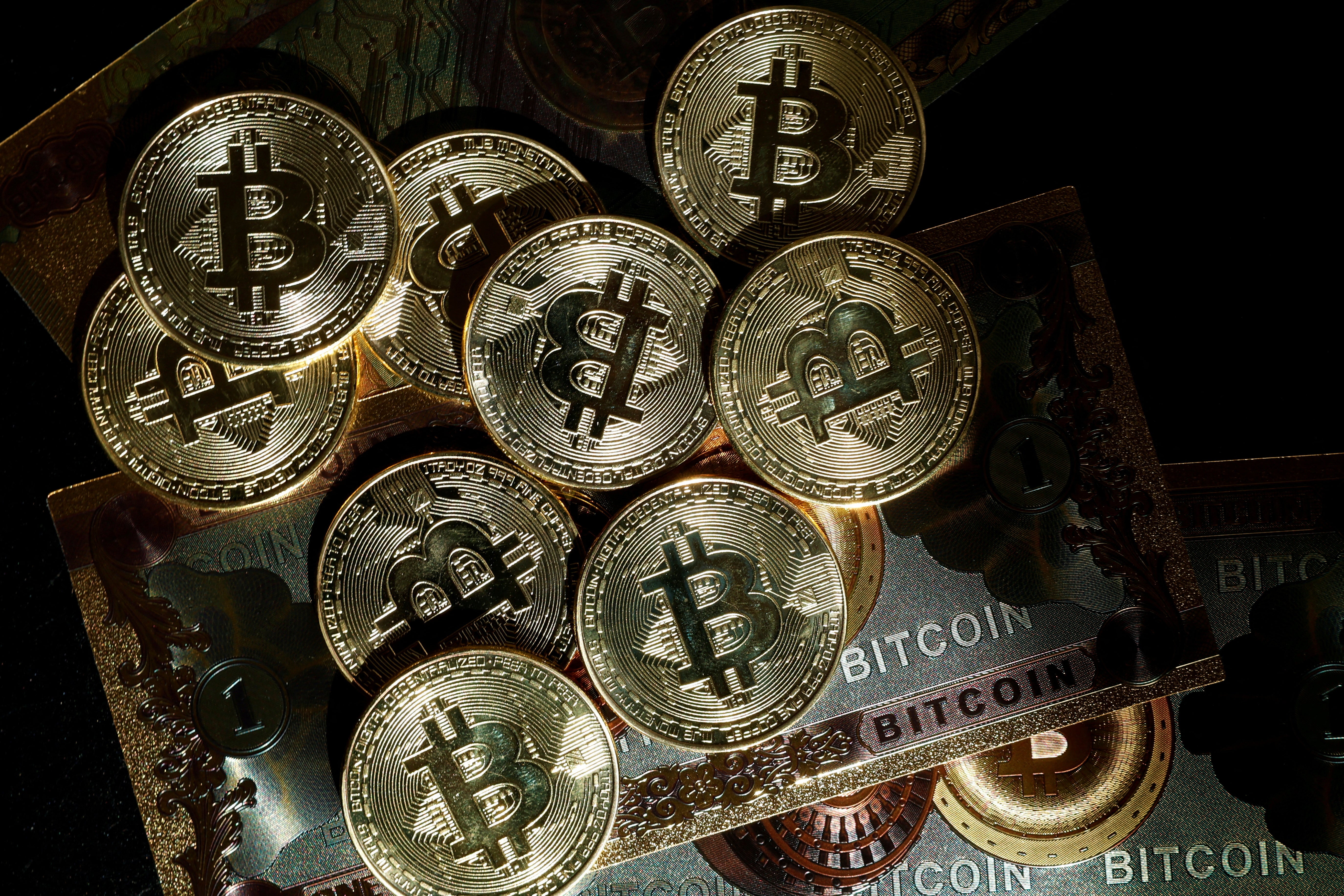 Representations of cryptocurrency Bitcoin are seen in this illustration picture taken in Paris, France