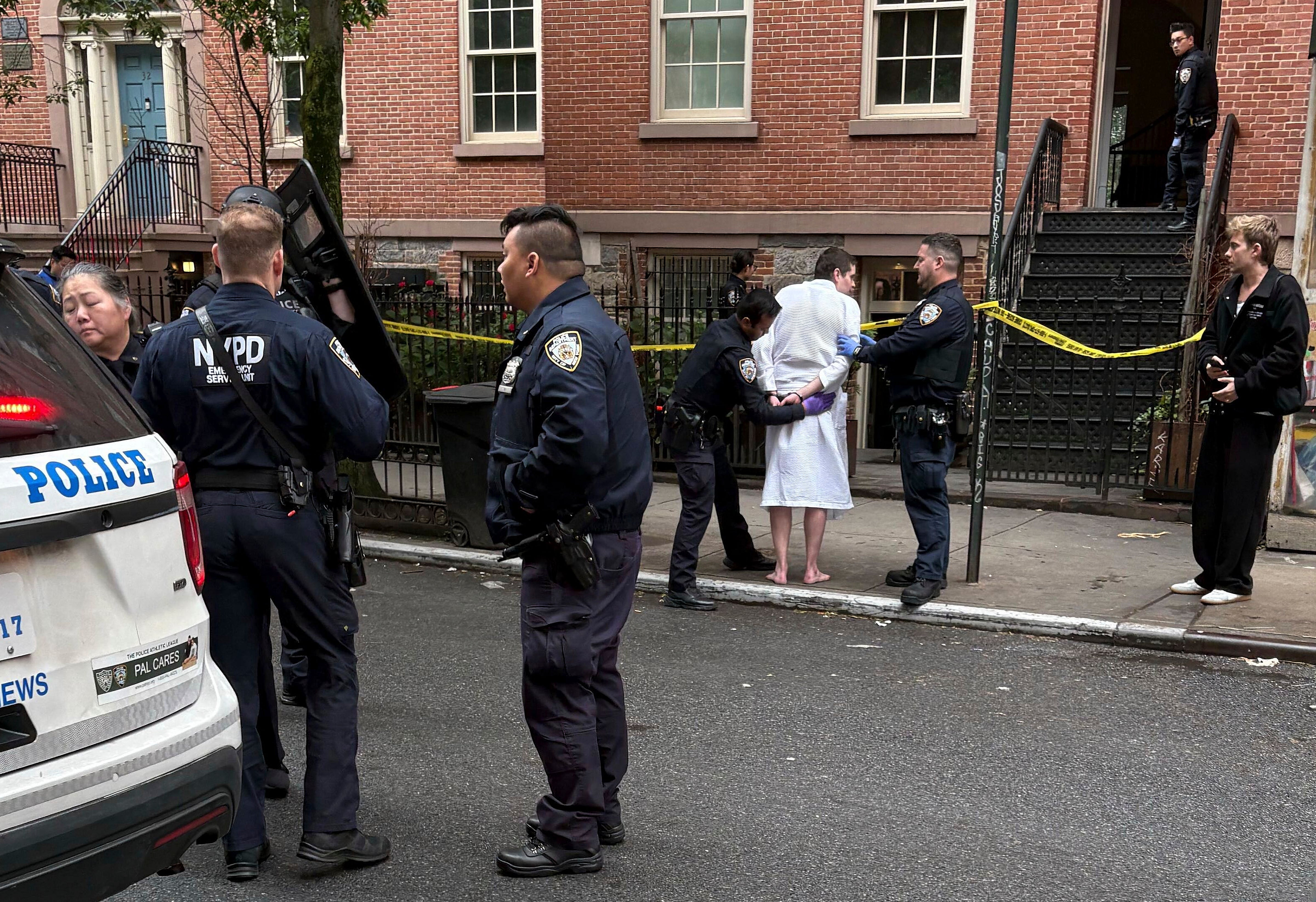 New York police officers arrest John Woeltz